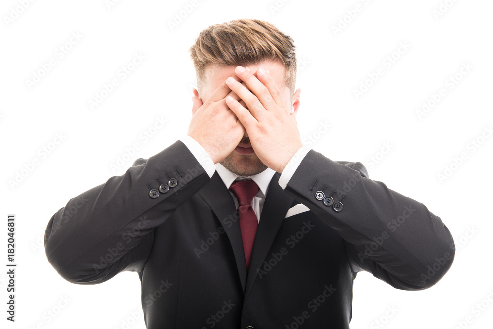 Handsome business man covering eyes like blind gesture Handsome business man covering eyes like blind gesture
