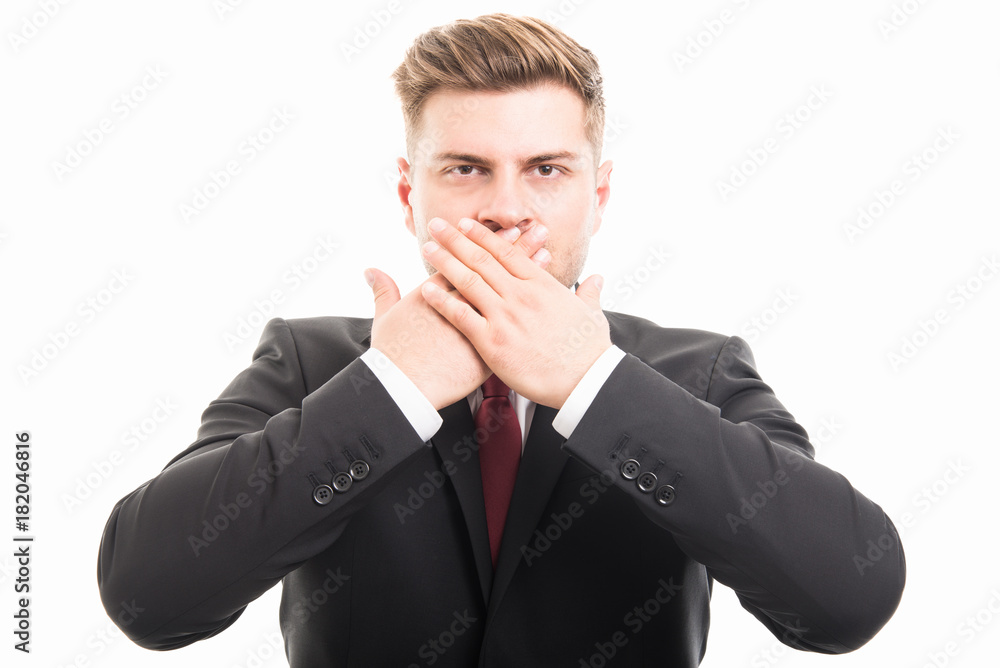 Handsome business man covering mouth like mute gesture Handsome business man covering mouth like mute gesture