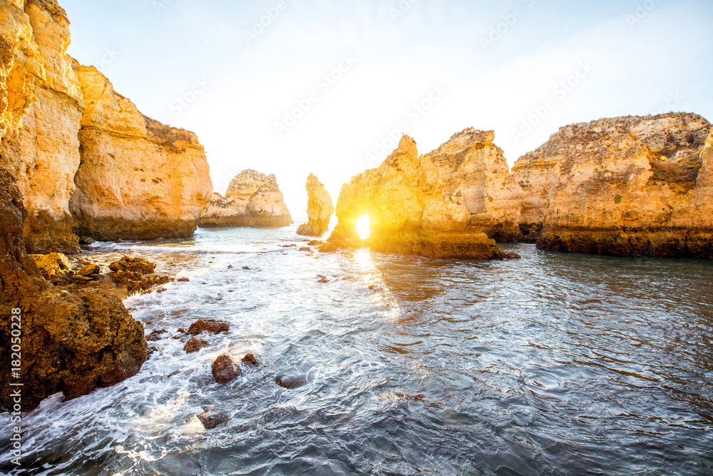 Beautiful landscape view on the rocky coastline on Ponta da Piedade during the sunrise near the Lagos city on the south of Portugal