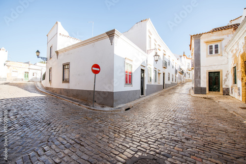 Street view with white houses in the old town of Faro on the south of Portugal