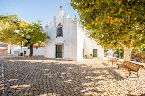 Typical village with white houses during the sunrise on the south of Portugal photo