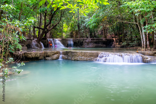 Waterfall flowing on tropical rainforest at huai mae khamin national park