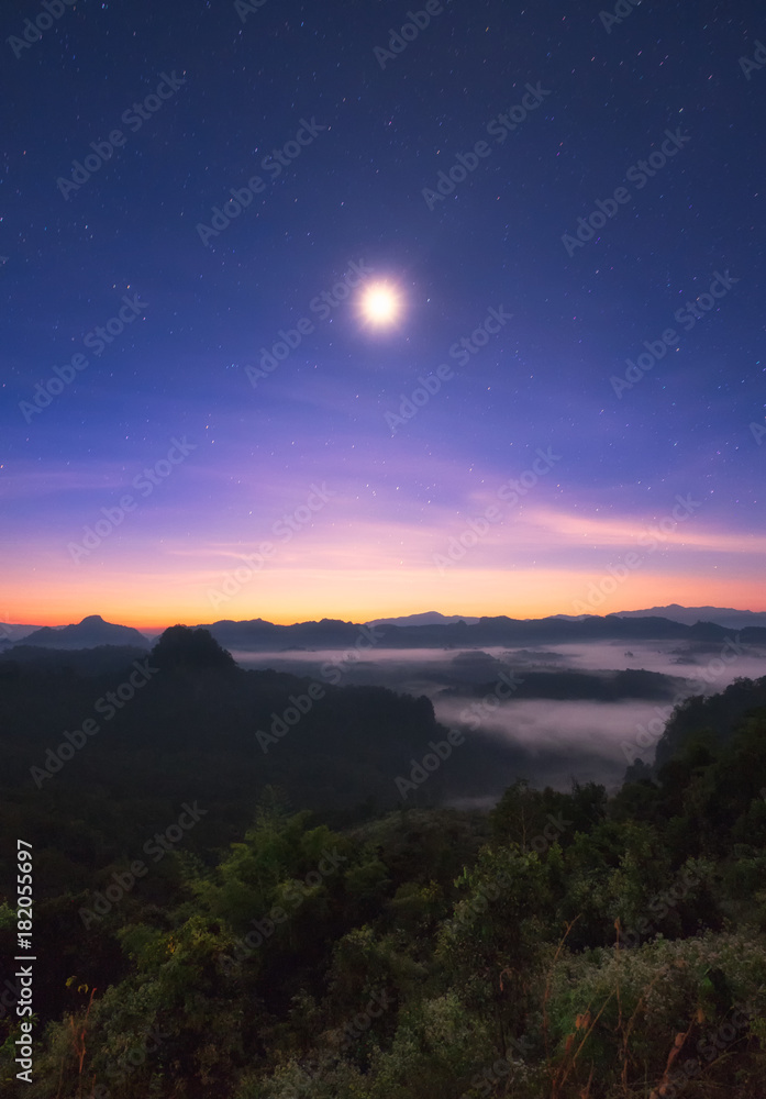 Viewpoint mist mountain colorful with the moon at dawn
