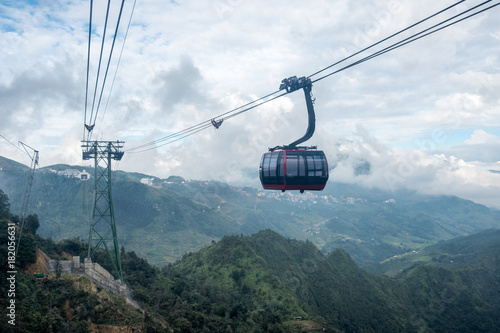 Red cable car sightseeing Sapa village in valley