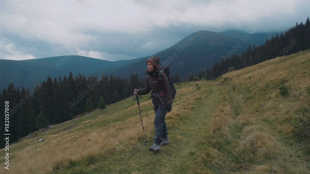young caucasian female hiking in mountains young caucasian female hiking in mountains
