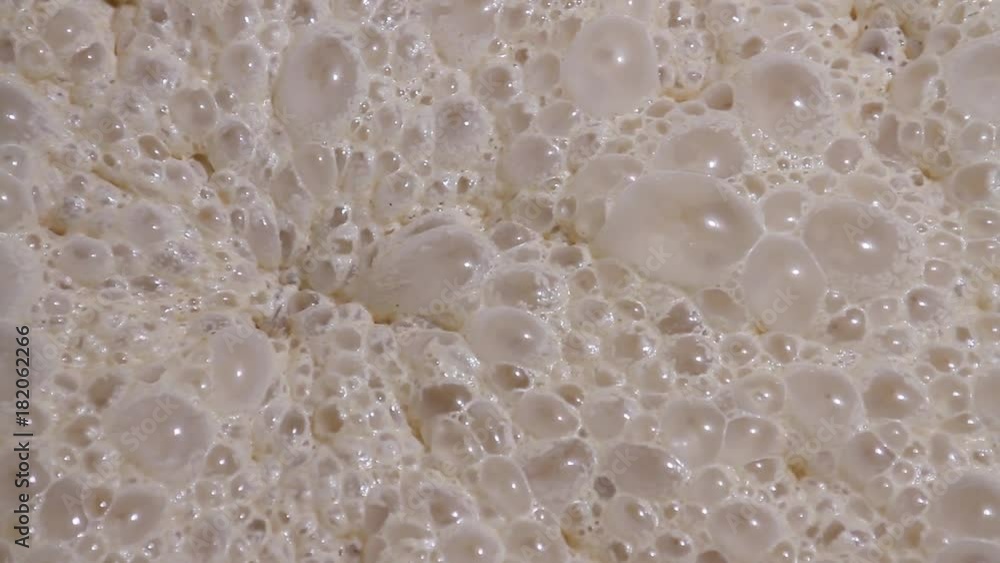 Fermentation process of yeast at the factory for baking bread close-up ...