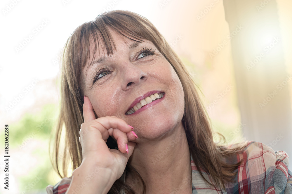 Portrait of smiling mature woman, light effect Portrait of smiling mature woman, light effect