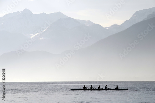 Rowers on row boat, Annecy lake, france photo