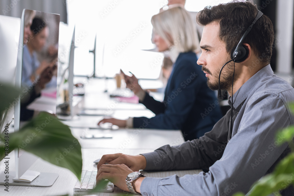 call center operator in headset in office call center operator in headset in office