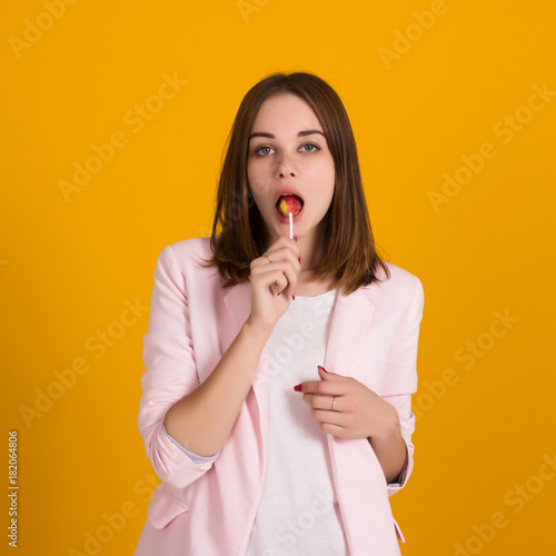 Young cute girl with lollipop, isolated 