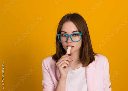 Young cute girl chews bubble gum, isolated  