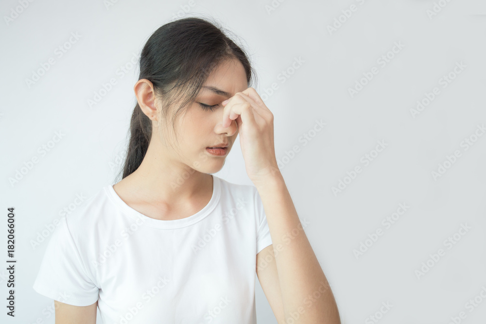 Woman touching her head with hands. Young asian woman feel headache. Isolated on white background. Woman touching her head with hands. Young asian woman feel headache. Isolated on white background.