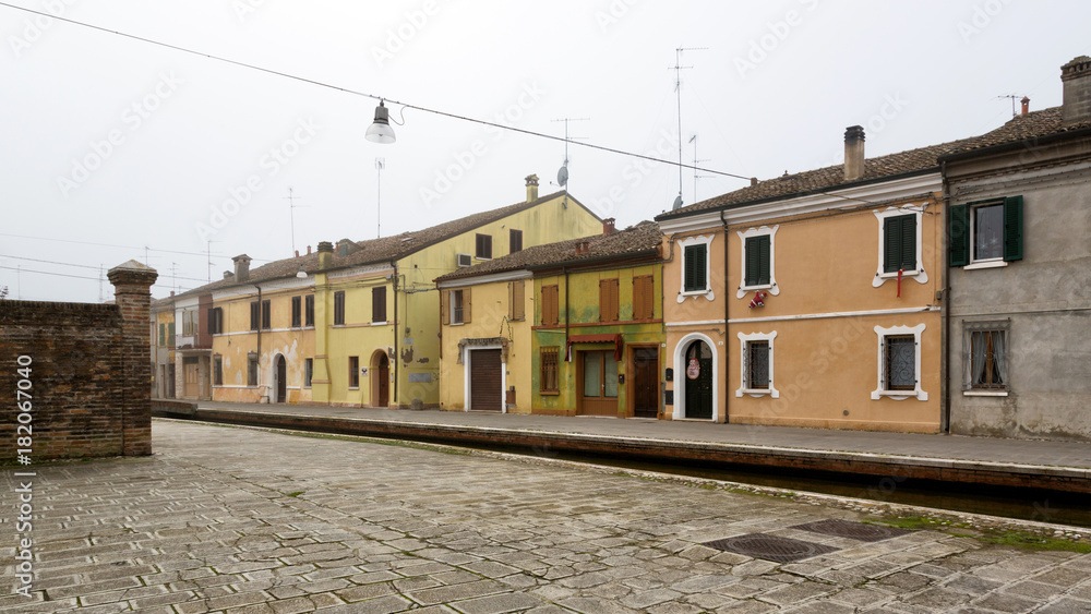 Comacchio (Italy) - Characteristic and fascinating historic town in the Park of the Po Delta, Comacchio has a maze of canals with small bridges and pastel-coloured houses.