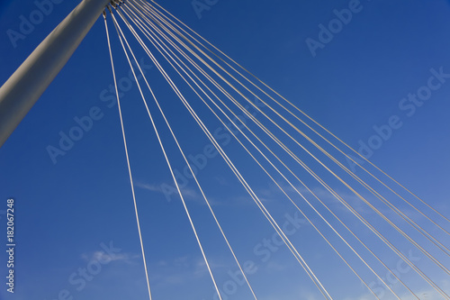 looking at the sky through the cables of a suspension bridge in the City of tampere. Finland. 