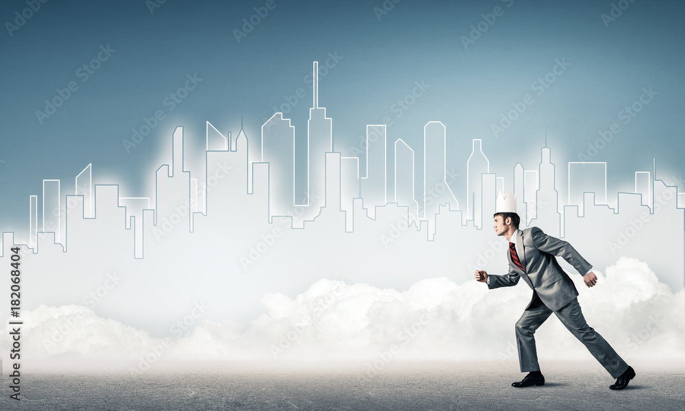 King businessman in elegant suit running and blue cityscape silh King businessman in elegant suit running and blue cityscape silh