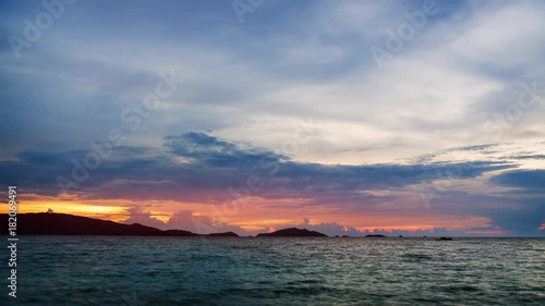 Bright evening and sunset on the tropical sea with islands on the horizon