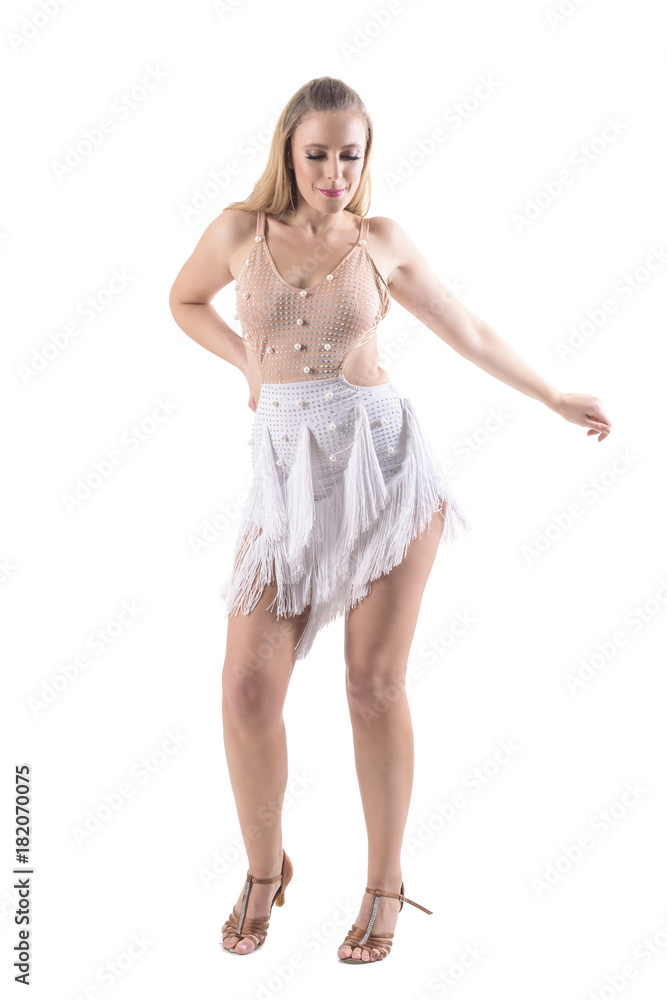 Professional female latino dancer in dance competition outfit dancing and swinging hips. Full body length portrait isolated on white background. Professional female latino dancer in dance competition outfit dancing and swinging hips. Full body length portrait isolated on white background.