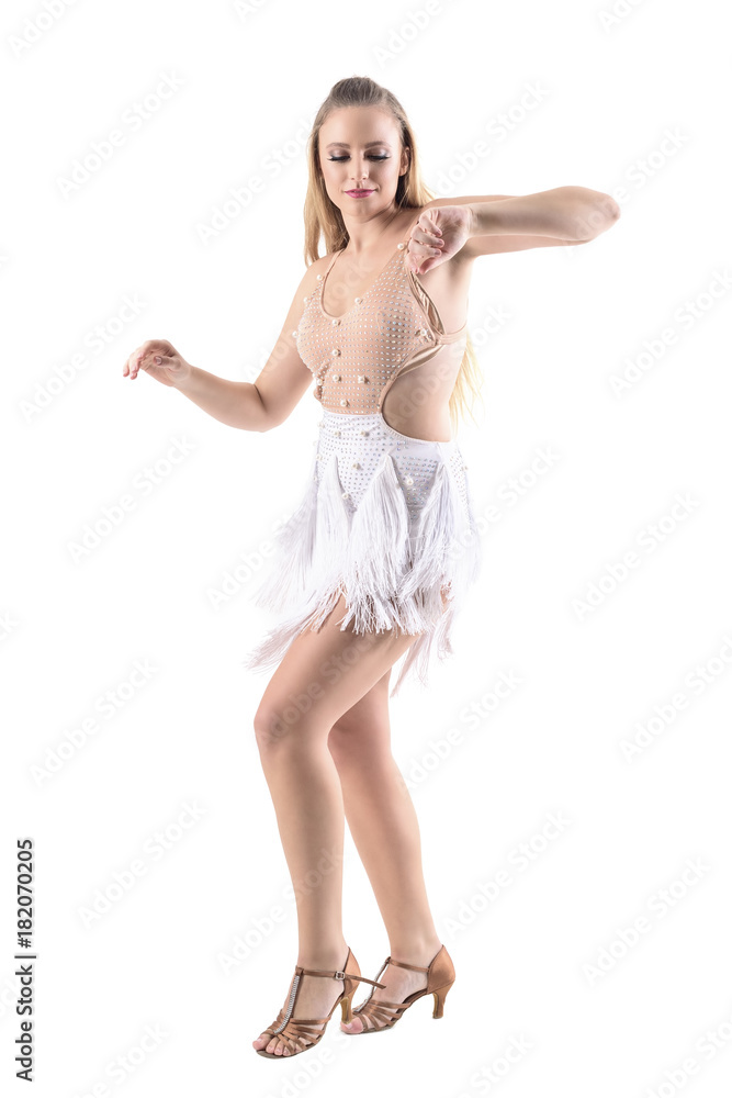 Female Latino skillful dancer moving arms smiling and looking down. Full body length portrait isolated on white studio background. Female Latino skillful dancer moving arms smiling and looking down. Full body length portrait isolated on white studio background.