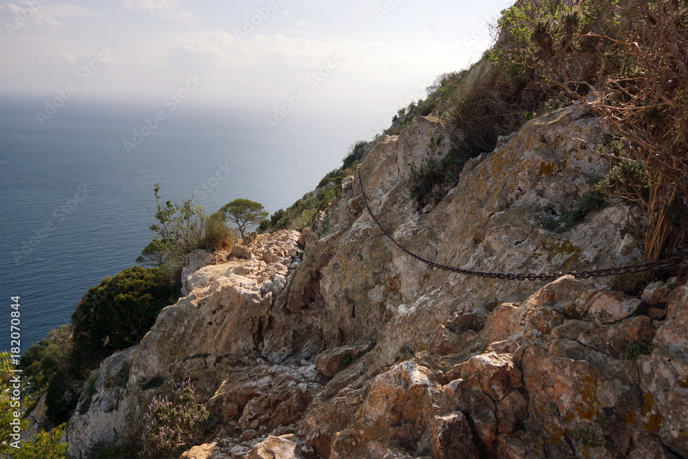 A metal chain for moving along a mountain path over the sea. A metal chain for moving along a mountain path over the sea.