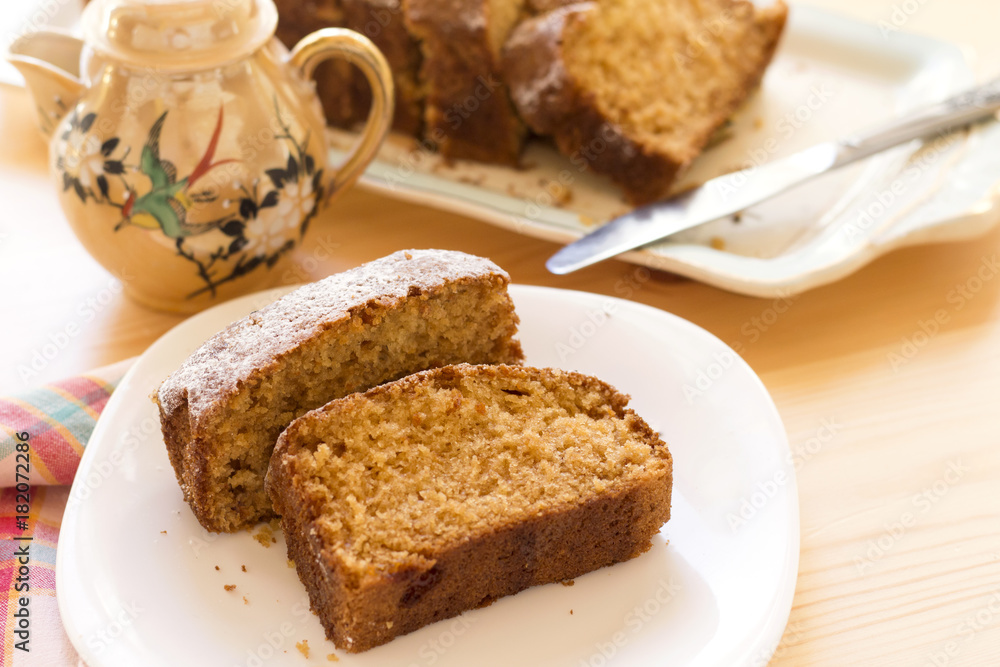 sweet almond homemade cake on white plate with coffee sweet almond homemade cake on white plate with coffee