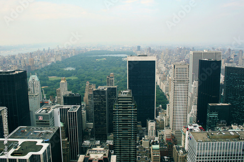 New York skyline and Central park glimpse in Summer cloudy evening