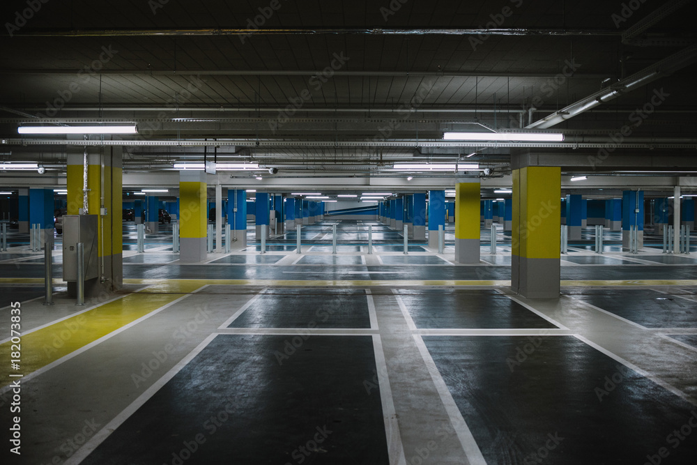 Close up on underground parking with empty slots Close up on underground parking with empty slots