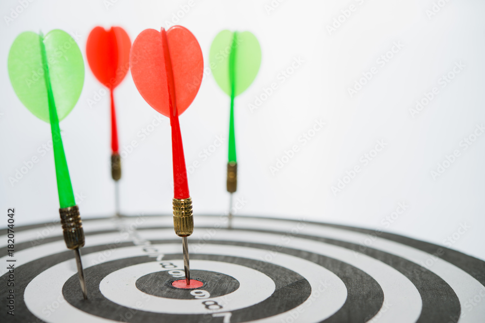Selective focus of dart arrow hit a center of the target. Selective focus of dart arrow hit a center of the target.
