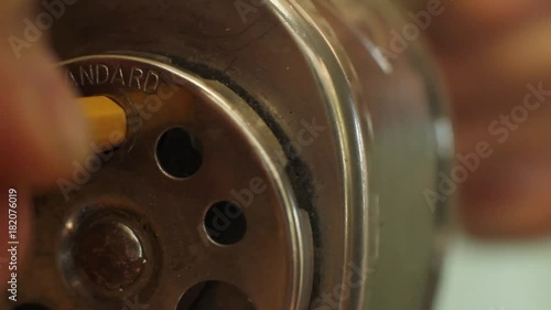 Close up of sharpening a pencil on a vintage sharpener