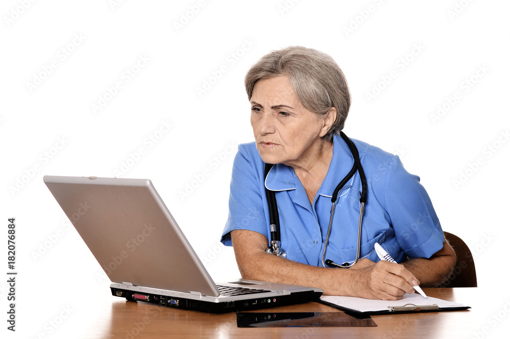 Confident female doctor looking at laptop Confident female doctor looking at laptop