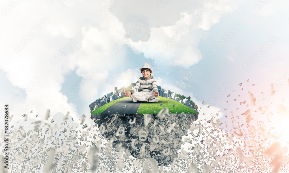 Naklejka premium Little boy keeping mind conscious.