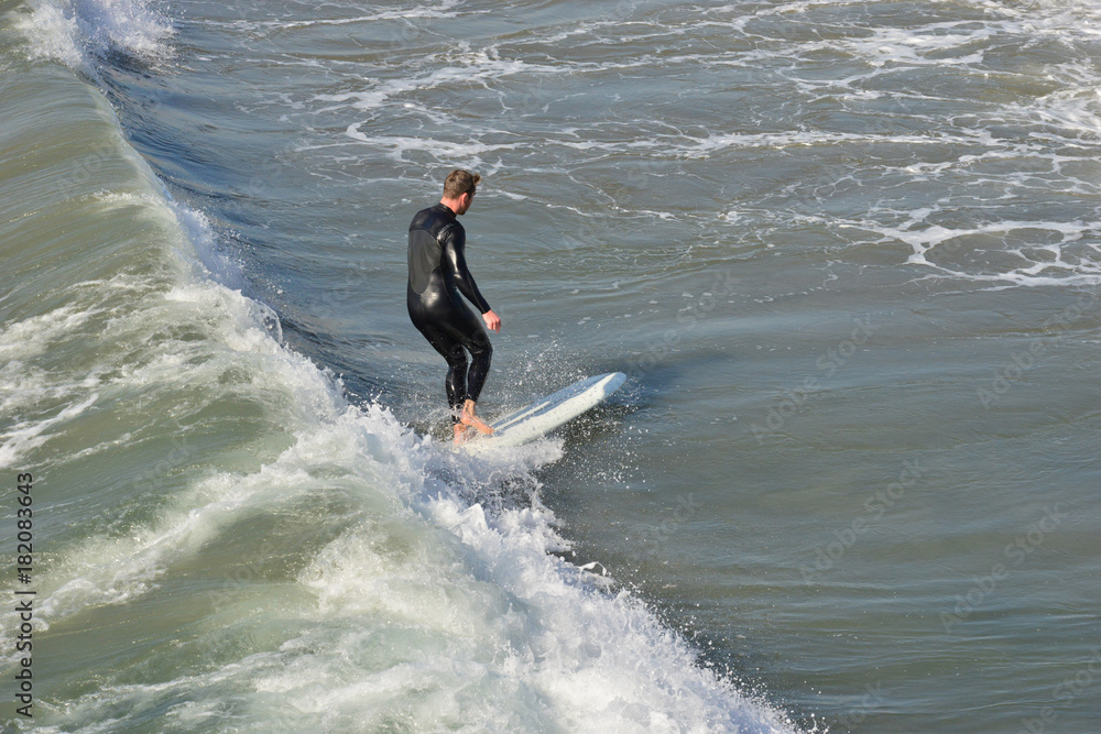 A surfer at Newport Beach, California. A surfer at Newport Beach, California.