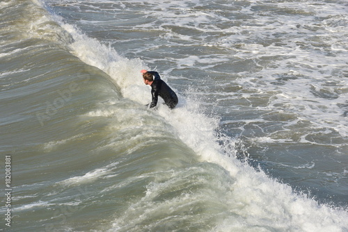 A surfer at Newport Beach, California.