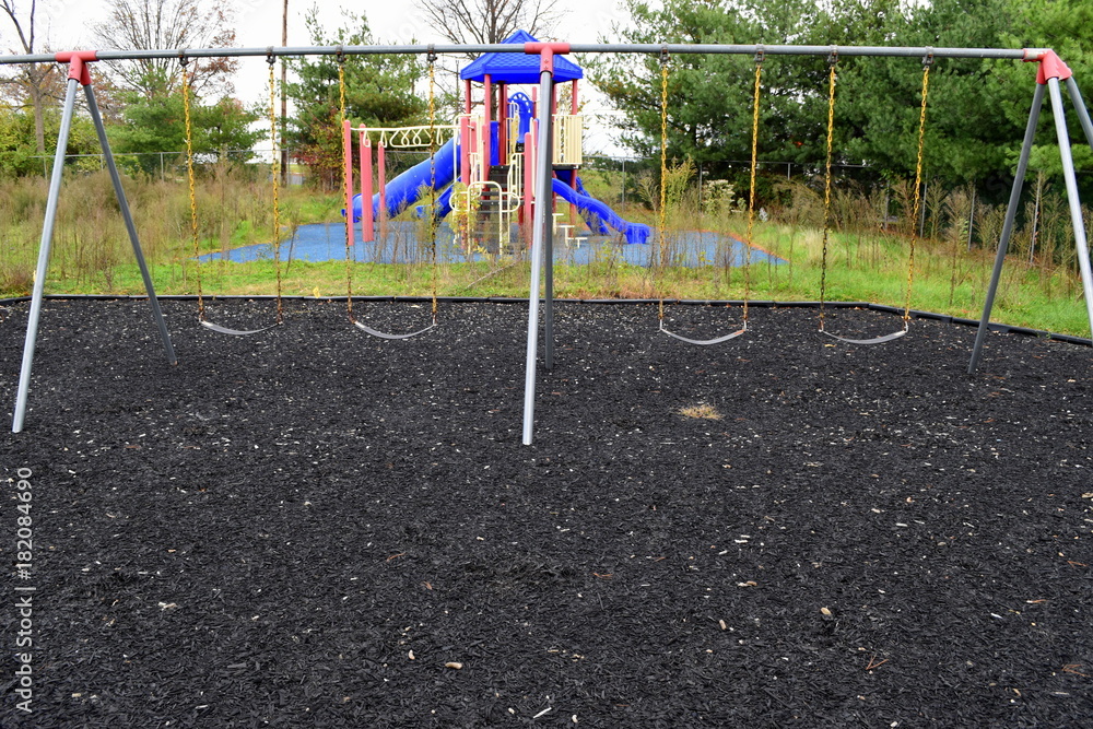Empty abandoned playground with weeds and decay Empty abandoned playground with weeds and decay