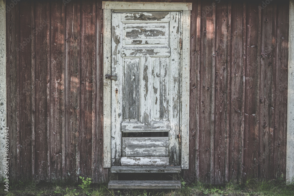 Old wooden door with weathered paint Old wooden door with weathered paint