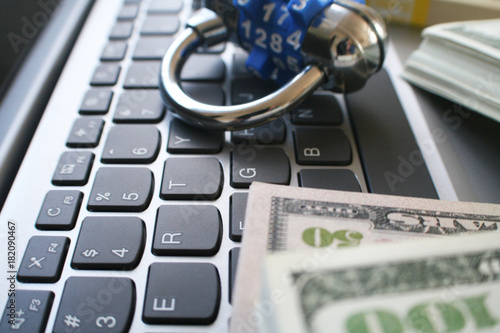 Cyber Security With Lock & Money On Computer Keyboard  photo