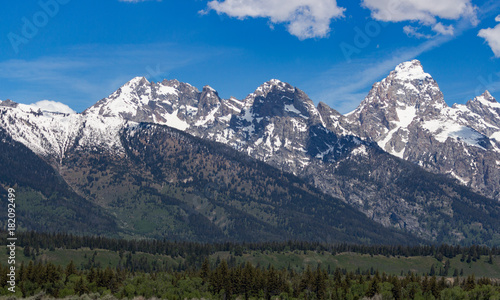 Grand Teton Mountain Range with blue sky and clouds