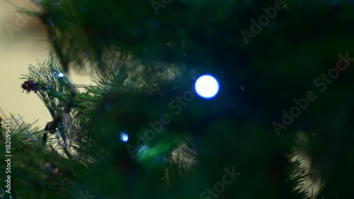 Rack Focus On A Christmas Tree Branch With Flickering Lights, Wintertime