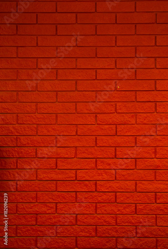 wall of small red bricks vertical. stone texture