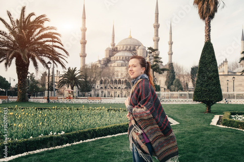 Photography Blue mosque of Istanbul and young traveler in foreground