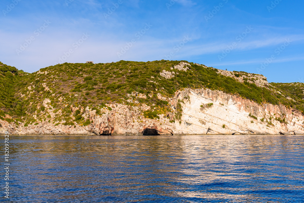 Rocky coast of Zakynhos island . View from cruise boat. Greece