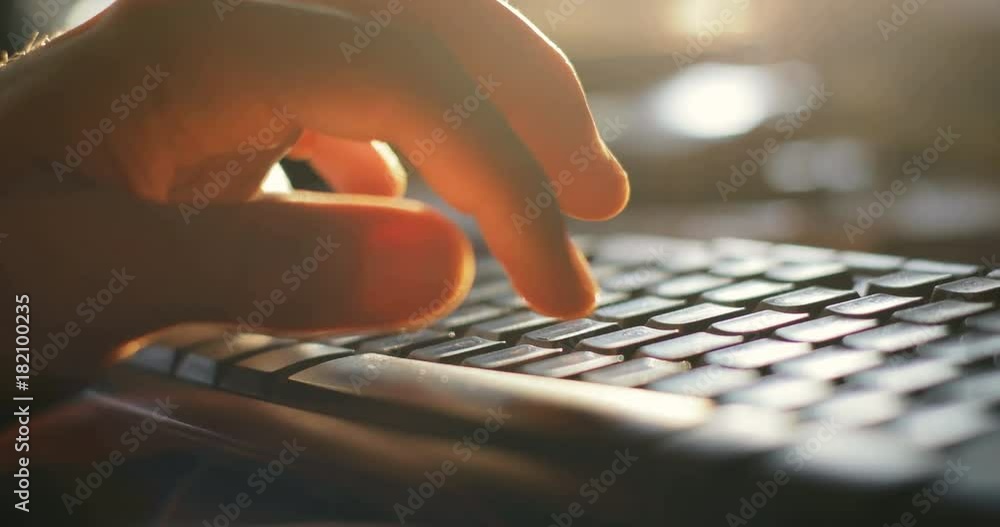Close up man hands typing on keybord in office sunlight online pc ...