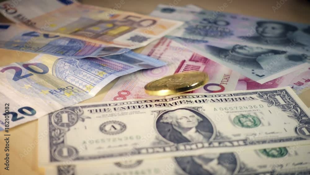 Golden bitcoin coin spinning over Dollar, euro and yuan bills. Financial concept. Situation of Bitcoin and other cryptocurrencies in the real world Golden bitcoin coin spinning over Dollar, euro and yuan bills. Financial concept. Situation of Bitcoin and other cryptocurrencies in the real world