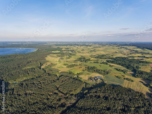 Aerial view over big lake Dusia in Lithuania, during sunny summer day. photo