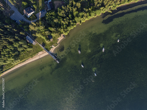 Aerial view over big lake Dusia in Lithuania, during sunny summer day. photo