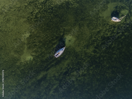 Aerial view over big lake Dusia in Lithuania, during sunny summer day. photo