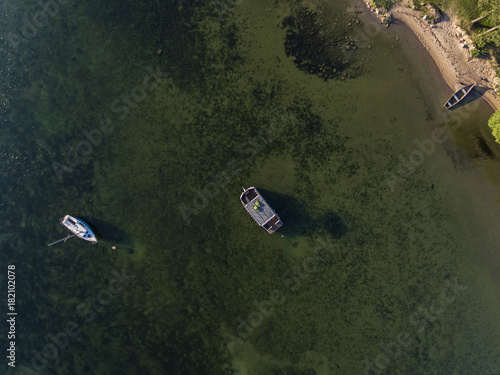 Aerial view over big lake Dusia in Lithuania, during sunny summer day. photo