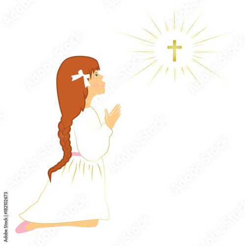 My first communion. Cute red hair girl praying on knees.
