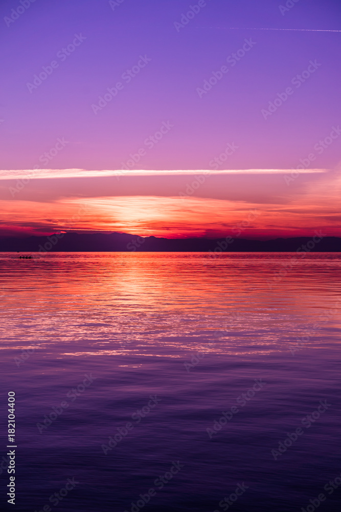Obraz premium After Sunset Colors by the Sea, Purple tones, Vertical shot