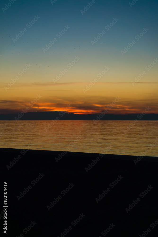 Obraz premium Tranquil scene with beautiful after sunset color tones by the sea