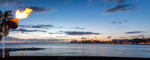 Kailua-Kona bay at sunset with a view of the pier. photo